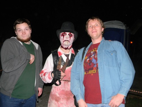 My brother Jarod Marchand (far left) and I (far right) hanging out with one of the Haunted Jail's many inmates (who's actually my co-worker Josh Case) in 2013. 