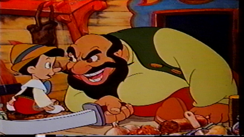He smiles as Stromboli nearly chops his arm off. Funny fact: Stromboli's a rather offensive Italian stereotype, with all that delicious angry broken English, yet the original story was written by an Italian. 