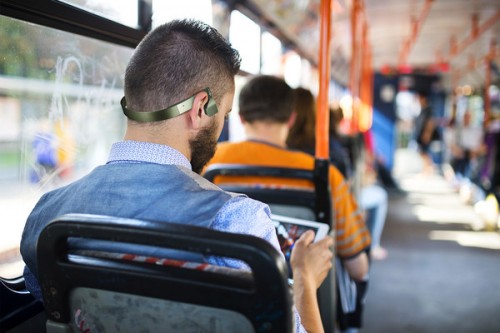 Man wearing Gamez headphones on the bus